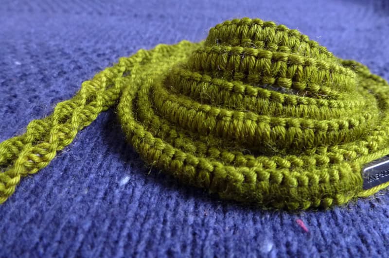 yarnbombed earphones macrame knitted headphones cosies